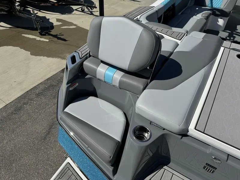 Slide: The Image of 2022 MasterCraft XT24 boat with gray and blue seating. - 4