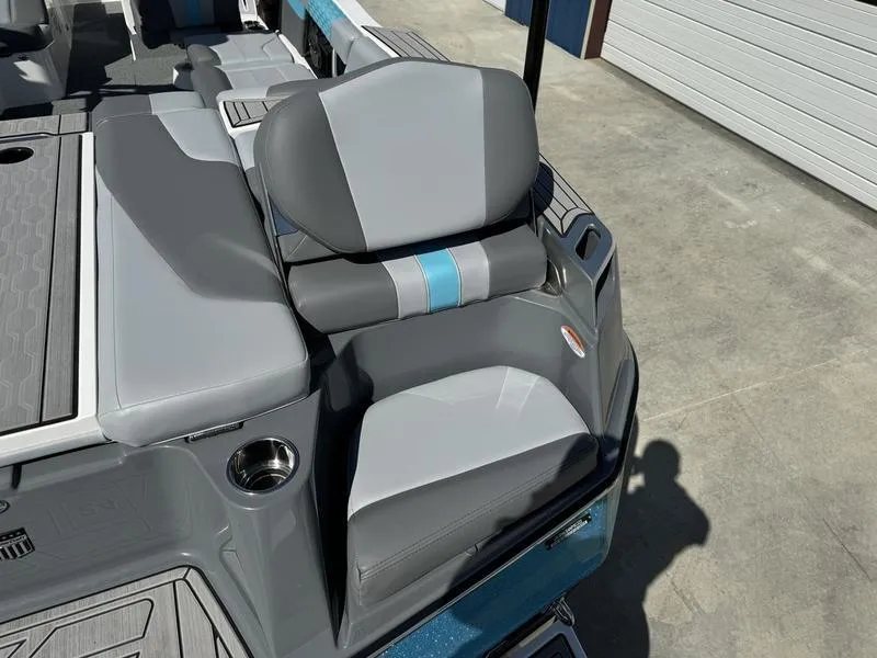 Slide: The Image of 2022 MasterCraft XT24 boat with gray and blue seating. - 5