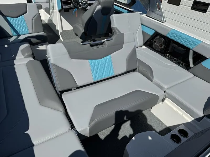 Slide: The Image of 2022 MasterCraft XT24 boat interior with gray and blue seating. - 7