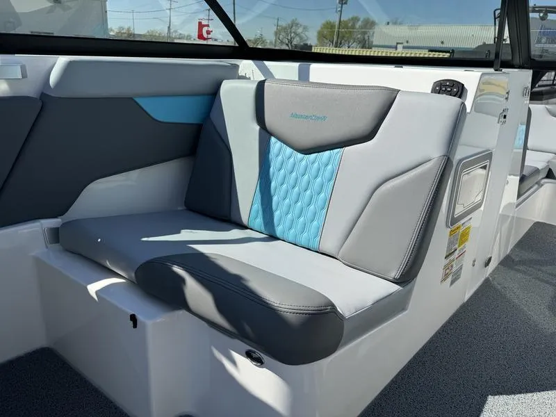 Slide: The Image of 2022 MasterCraft XT24 boat interior with gray and blue seating. - 8