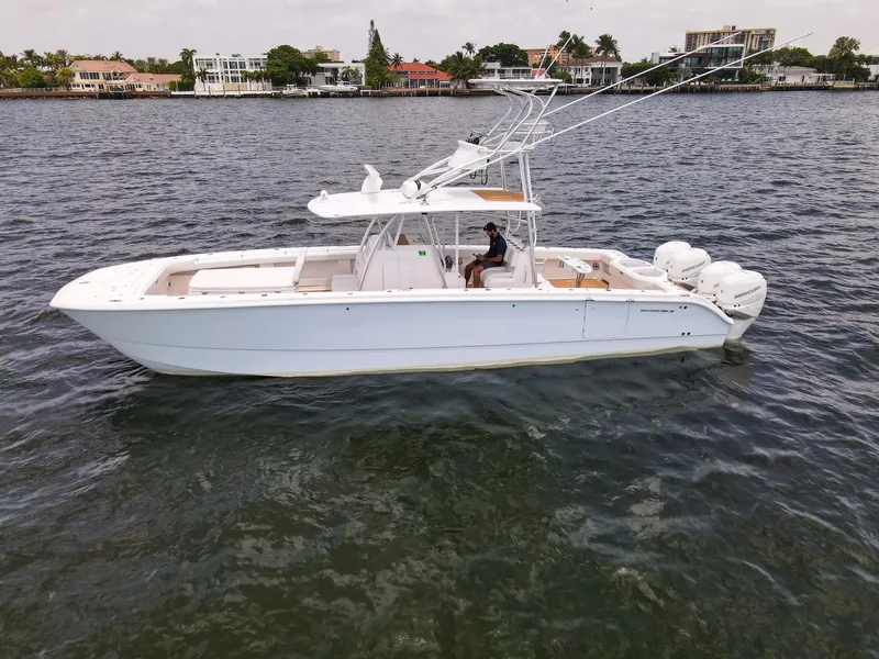 The Image of 2020 Invincible 40 Catamaran on water, side view, with triple outboard engines. - 0