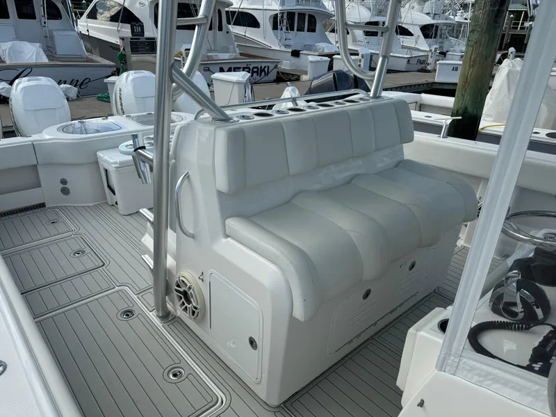 Slide: The Image of 2020 Invincible 40 Catamaran interior with white seating and deck, docked at marina. - 16