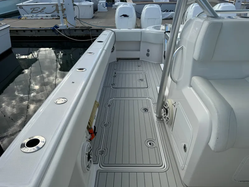 Slide: The Image of 2020 Invincible 40 Catamaran interior with sleek deck and seating at marina. - 19