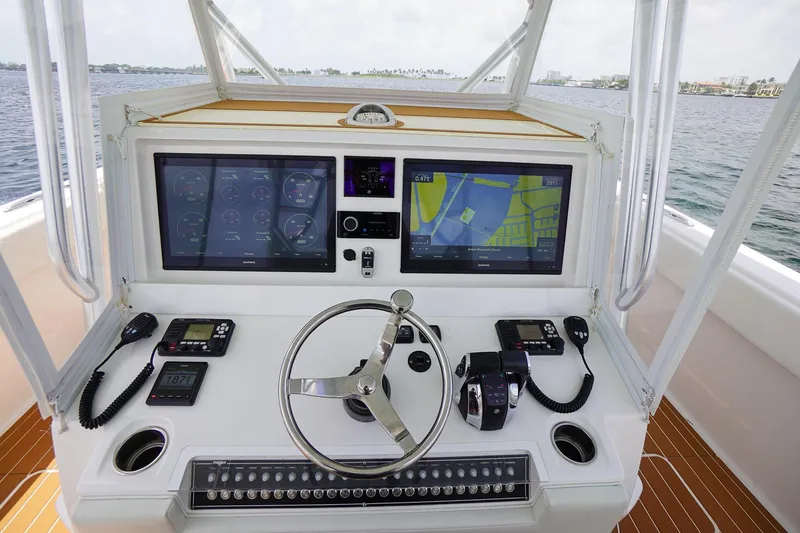 Slide: The Image of Cockpit of 2020 Invincible 40 Catamaran with advanced navigation and control systems. - 3