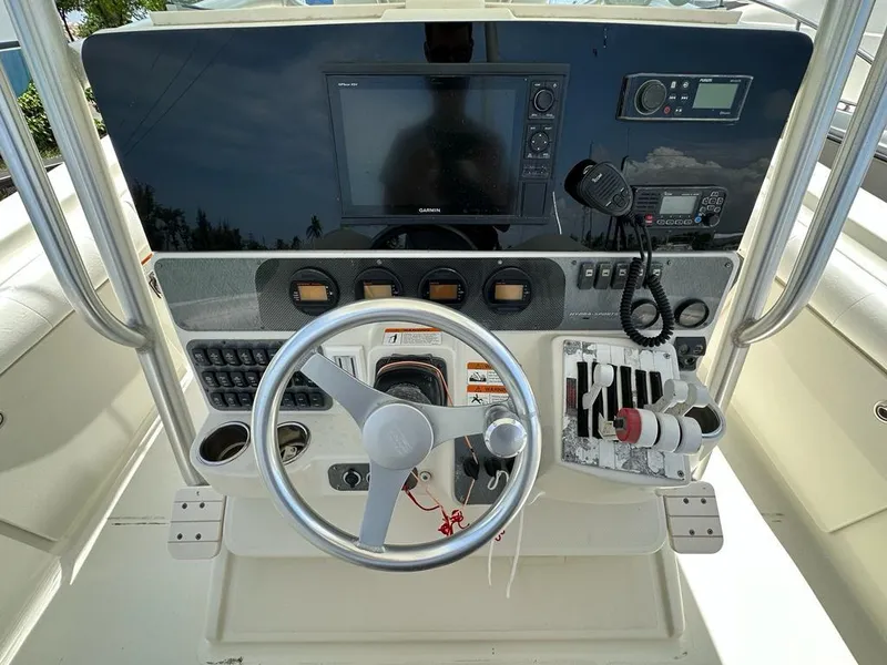 Slide: The Image of 2007 Hydra-Sports Vector 3300 CC boat dashboard with steering wheel and navigation controls. - 5
