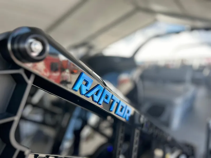 Slide: The Image of Close-up of 2024 Bennington 28 QXSBA x1 boat with Raptor branding. - 10