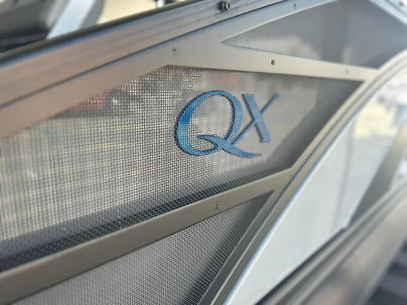 Slide: The Image of 2024 Bennington 28 QXSBA x1 boat with QX logo detail. - 12