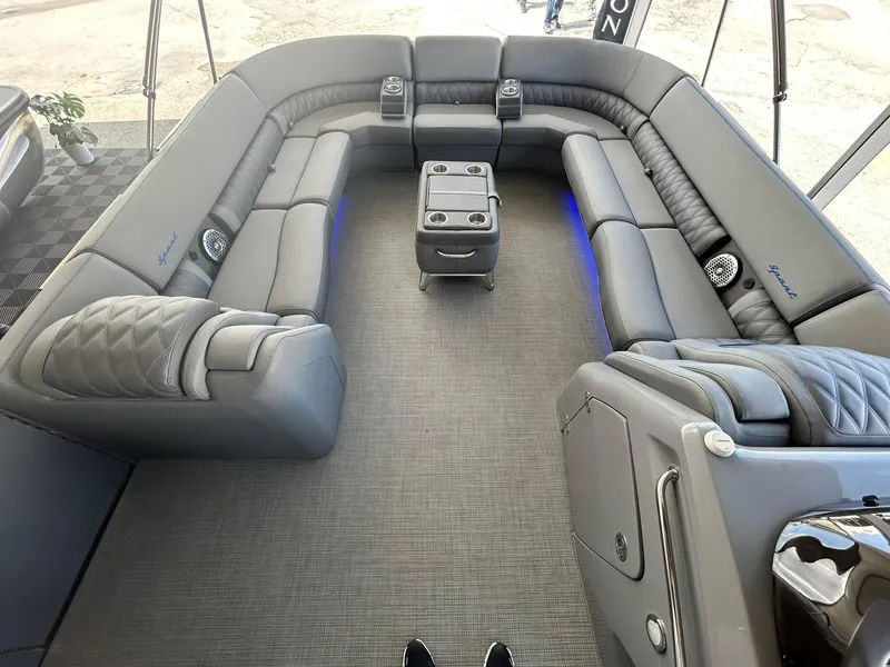 Slide: The Image of 2024 Bennington 28 QXSBA x1 luxury pontoon boat interior with plush seating and LED lighting. - 20