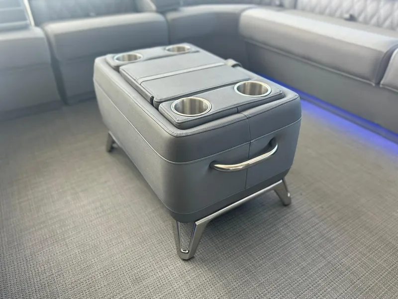 Slide: The Image of Luxurious seating area on the 2024 Bennington 28 QXSBA x1 boat with a stylish ottoman. - 21