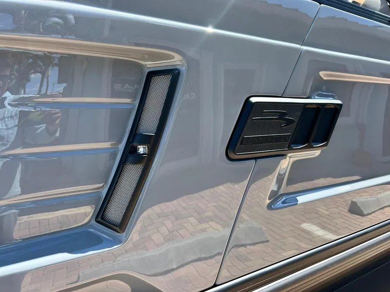 Slide: The Image of 2024 Bennington 28 QXSBA x1 side panel detail with sleek design and modern accents. - 7