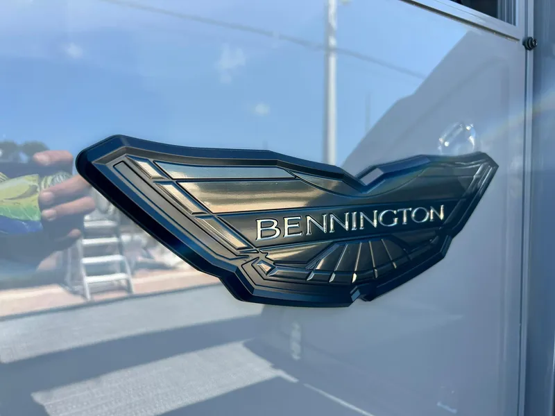 Slide: The Image of 2024 Bennington 28 QXSBA x1 logo on boat exterior. - 8