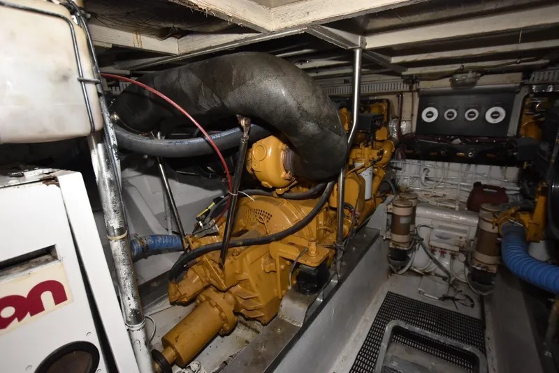 Slide: The Image of Engine room of a 1987 Hatteras SportFish boat with CAT engines. - 28