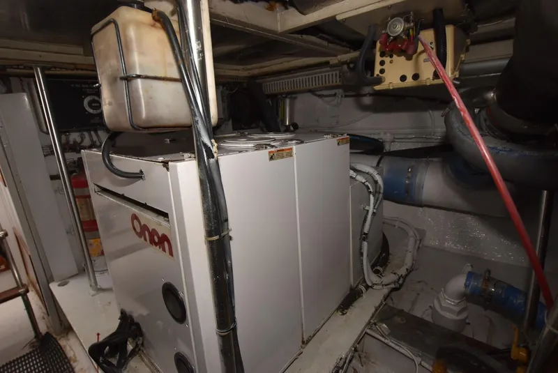 Slide: The Image of 1987 Hatteras SportFish engine room with Onan generator. - 32