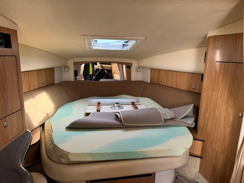 Slide: The Image of Interior cabin of 2006 Sea Ray 320 Sundancer with bed and skylight. - 21