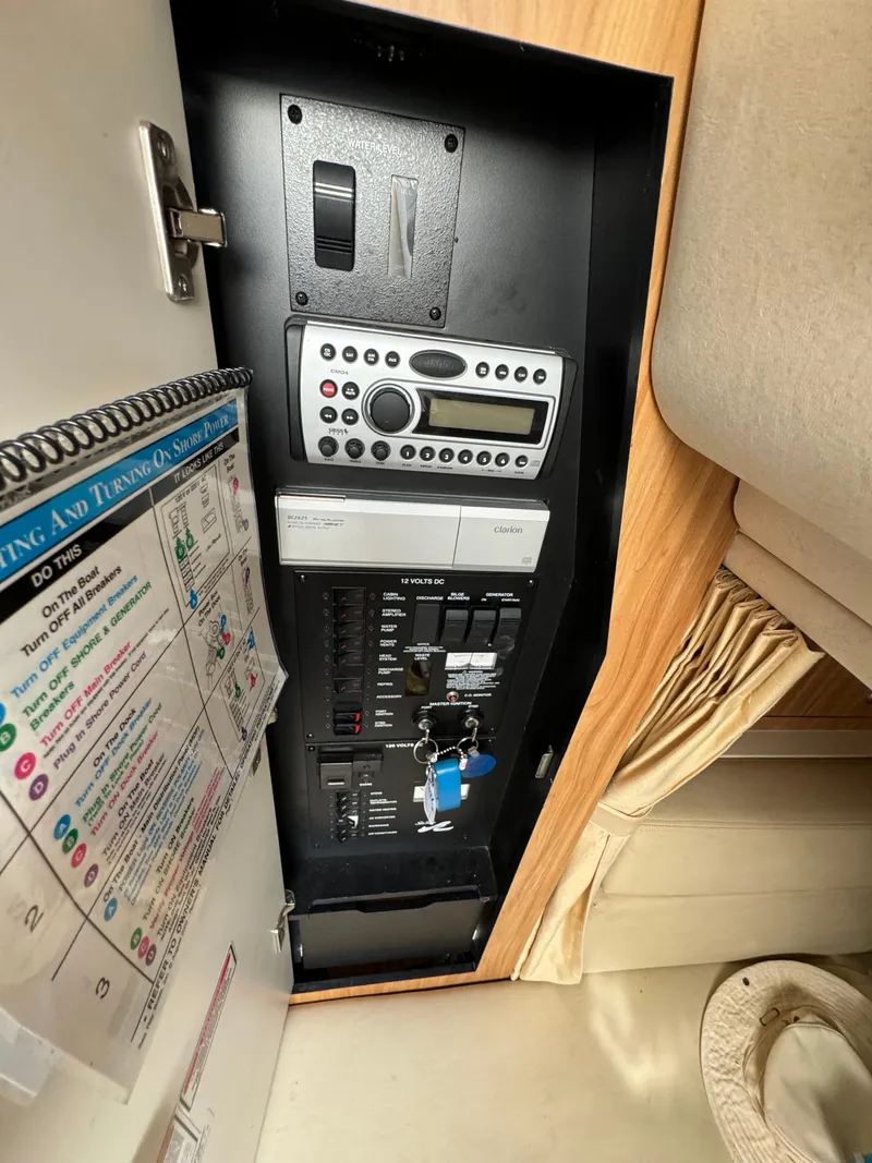 Slide: The Image of Electrical control panel of a 2006 Sea Ray 320 Sundancer boat. - 25