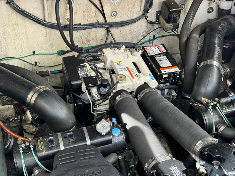 Slide: The Image of Engine compartment of a 2006 Sea Ray 320 Sundancer boat. - 32