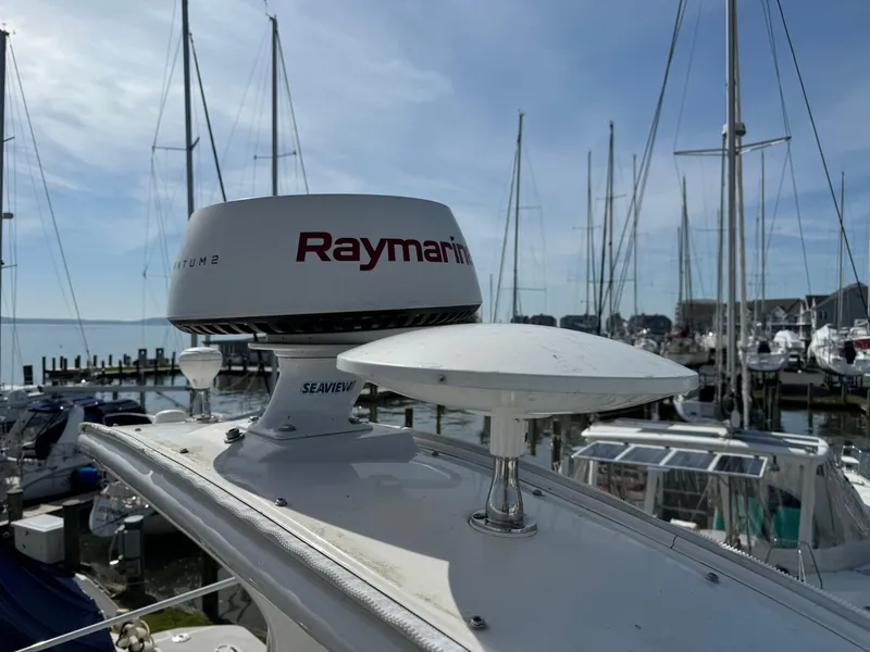 Slide: The Image of Close-up of Raymarine radar on a 2006 Sea Ray 320 Sundancer yacht at a marina. - 9