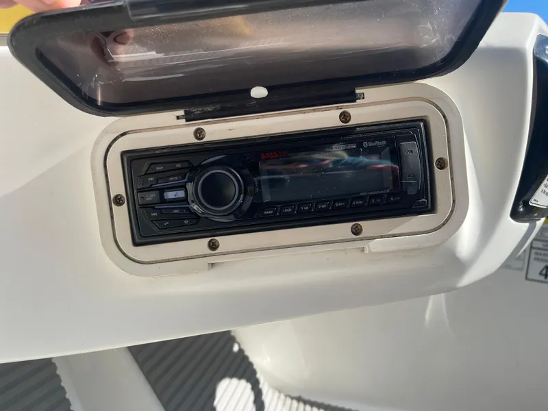 Slide: The Image of 2010 Sea-Doo 150 Speedster stereo system with protective cover open. - 11