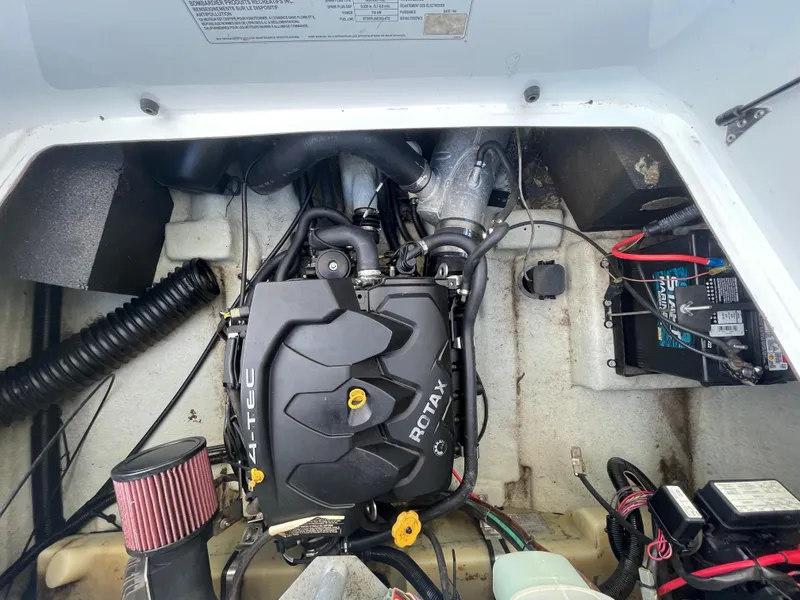 Slide: The Image of 2010 Sea-Doo 150 Speedster engine compartment with Rotax engine and battery. - 18