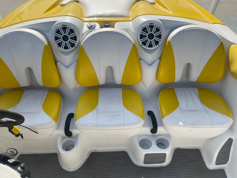 Slide: The Image of 2010 Sea-Doo 150 Speedster boat interior with yellow and white seats. - 8