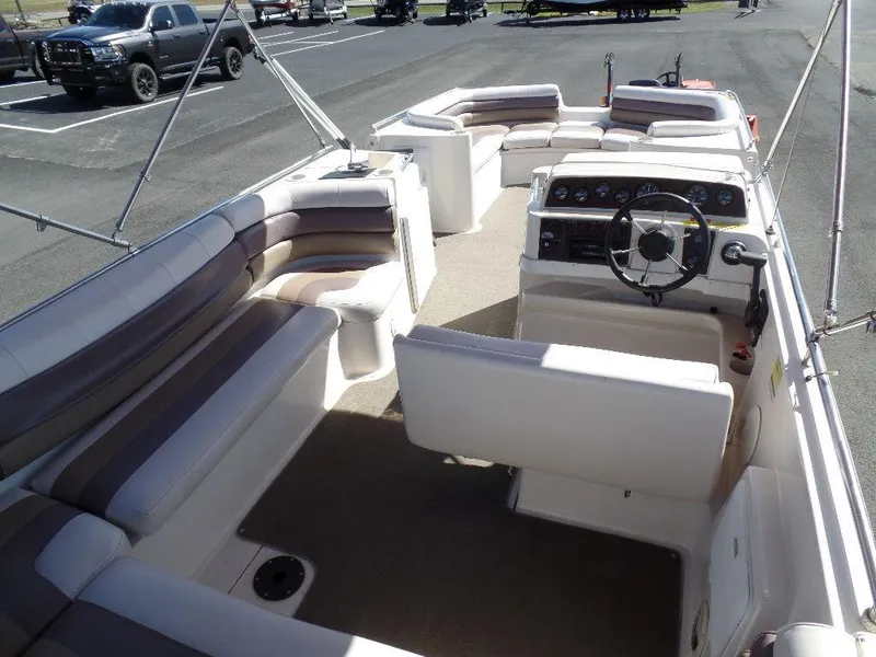 Slide: The Image of 1996 Hurricane Fun Deck boat interior with seating and steering console. - 12
