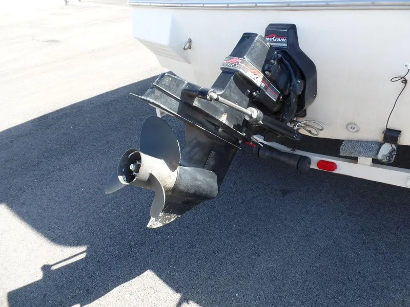 Slide: The Image of 1996 Hurricane Fun Deck boat with outboard motor and propeller. - 14