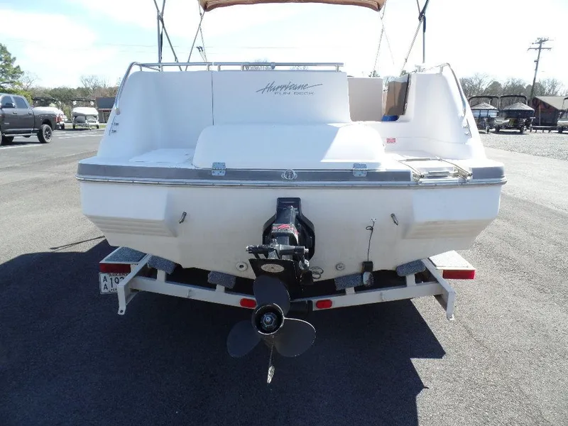 Slide: The Image of 1996 Hurricane Fun Deck boat rear view on trailer. - 17