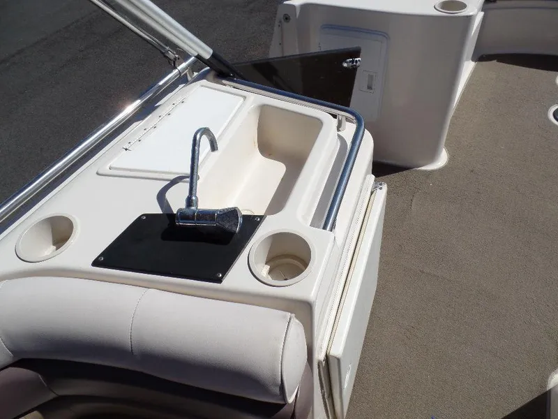 Slide: The Image of 1996 Hurricane Fun Deck boat interior with sink and storage compartments. - 5