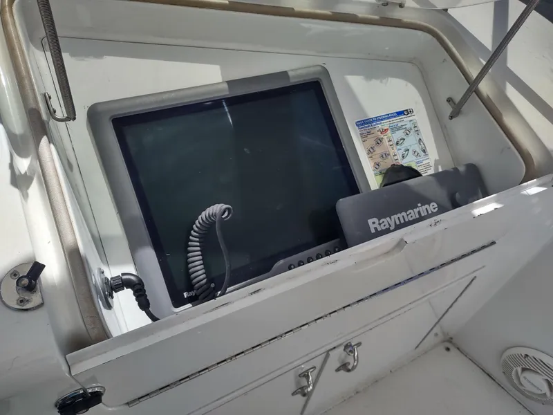 Slide: The Image of Raymarine navigation system on 1995 Hatteras 52 Cockpit Motor Yacht dashboard. - 13