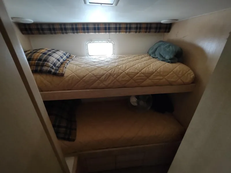 Slide: The Image of Bunk beds in 1995 Hatteras 52 Cockpit Motor Yacht cabin with plaid accents. - 26