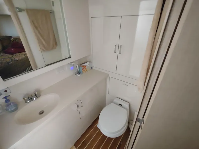 Slide: The Image of Bathroom interior of 1995 Hatteras 52 Cockpit Motor Yacht with sink and toilet. - 30