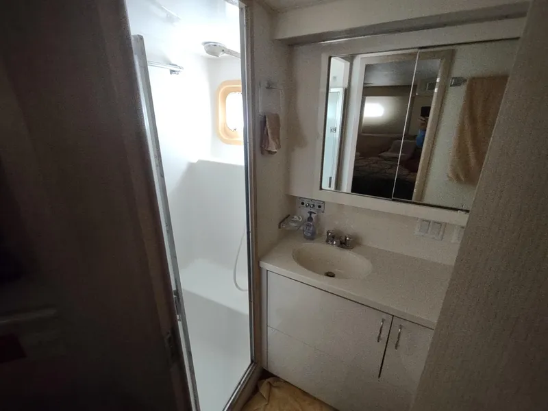 Slide: The Image of Bathroom interior of 1995 Hatteras 52 Cockpit Motor Yacht with shower and vanity. - 31