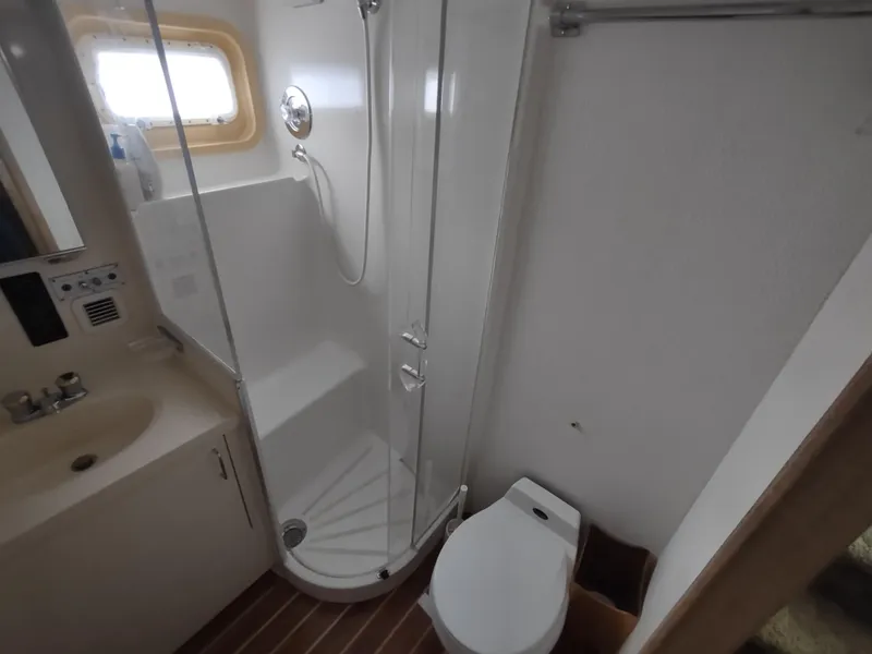 Slide: The Image of Bathroom interior of 1995 Hatteras 52 Cockpit Motor Yacht with shower and toilet. - 33