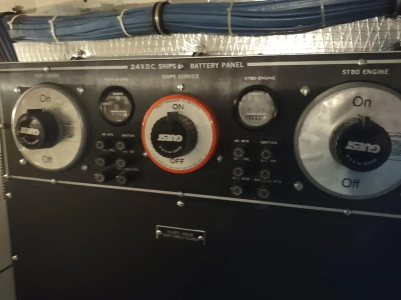 Slide: The Image of Battery panel of 1995 Hatteras 52 Cockpit Motor Yacht with switches and gauges. - 40