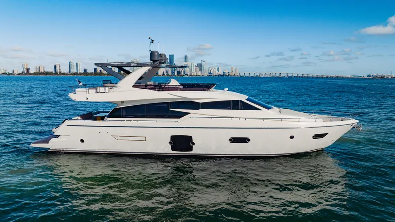Slide: The Image of 2017 Ferretti Yachts 750 on open water with city skyline in background. - 0