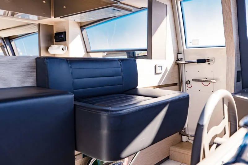 Slide: The Image of Interior helm station of 2017 Ferretti Yachts 750 with black leather seating. - 29