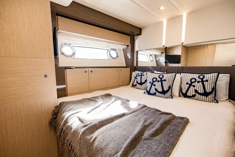Slide: The Image of Luxurious bedroom interior of 2017 Ferretti Yachts 750 with nautical-themed pillows. - 39