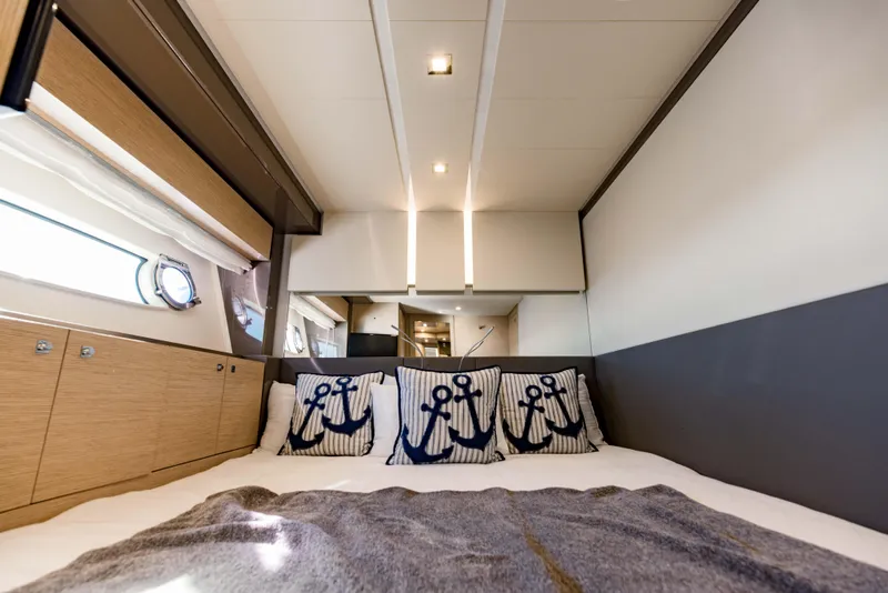 Slide: The Image of Luxurious bedroom interior of 2017 Ferretti Yachts 750 with nautical-themed pillows. - 40