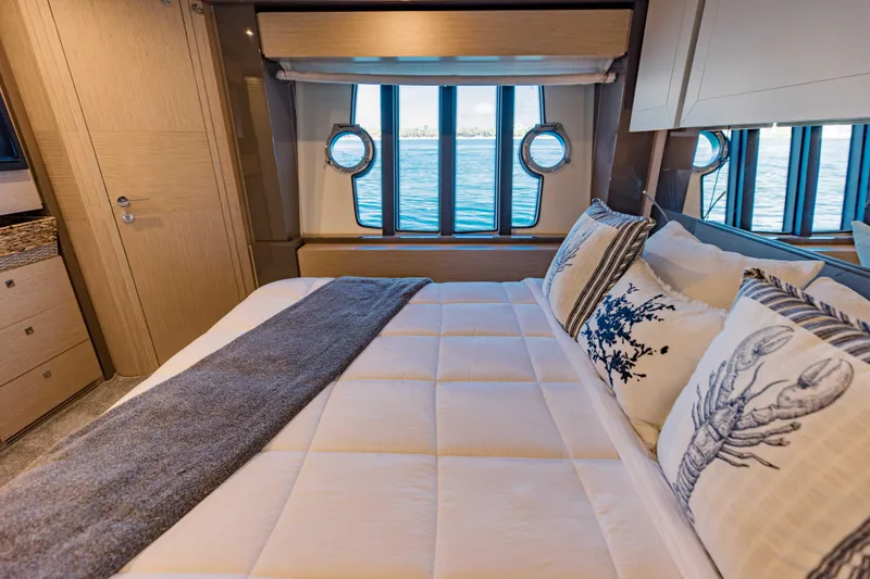 Slide: The Image of Luxurious bedroom in 2017 Ferretti Yachts 750 with ocean view through porthole windows. - 46