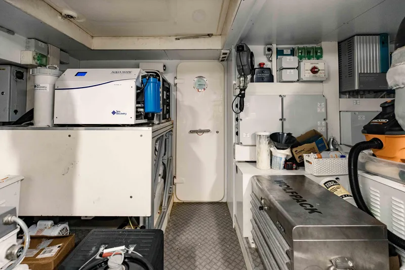 Slide: The Image of Engine room of a 2017 Ferretti Yachts 750, featuring various equipment and storage. - 49