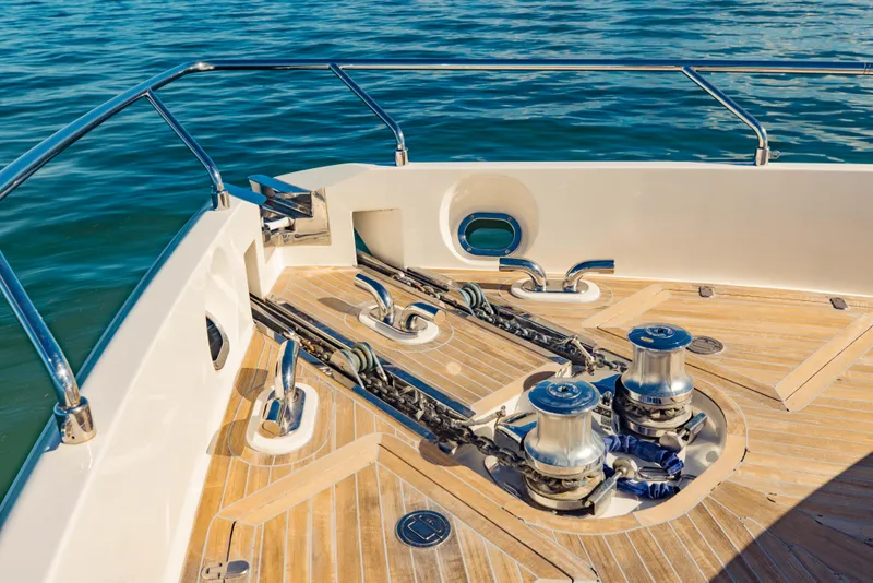 Slide: The Image of 2017 Ferretti Yachts 750 bow deck with anchor winches and teak flooring. - 5