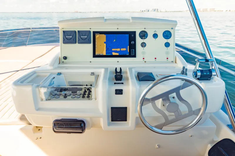Slide: The Image of 2017 Ferretti Yachts 750 helm station with navigation equipment and steering wheel. - 9