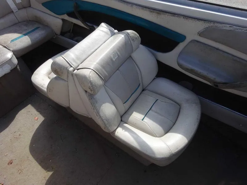 Slide: The Image of 1995 Four Winns 205 Sundowner boat interior with worn white seats. - 15