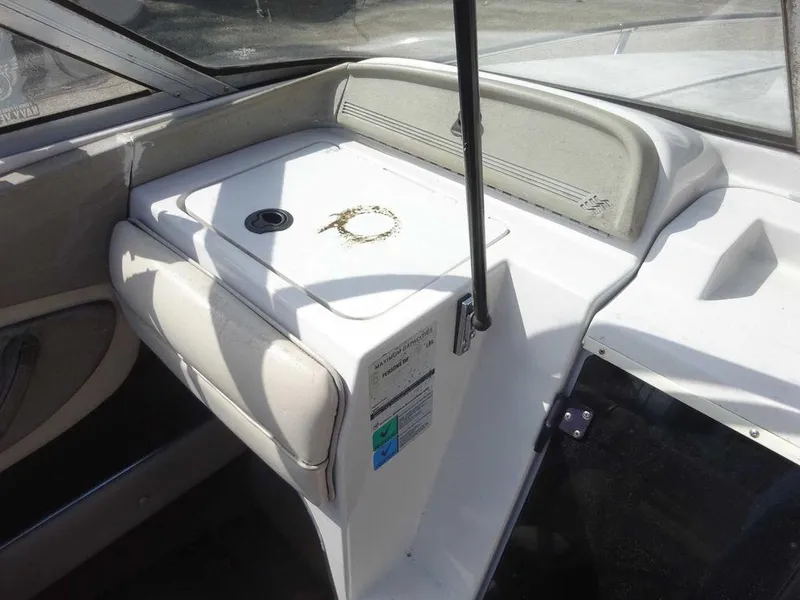 Slide: The Image of 1995 Four Winns 205 Sundowner boat interior console and seating area. - 18