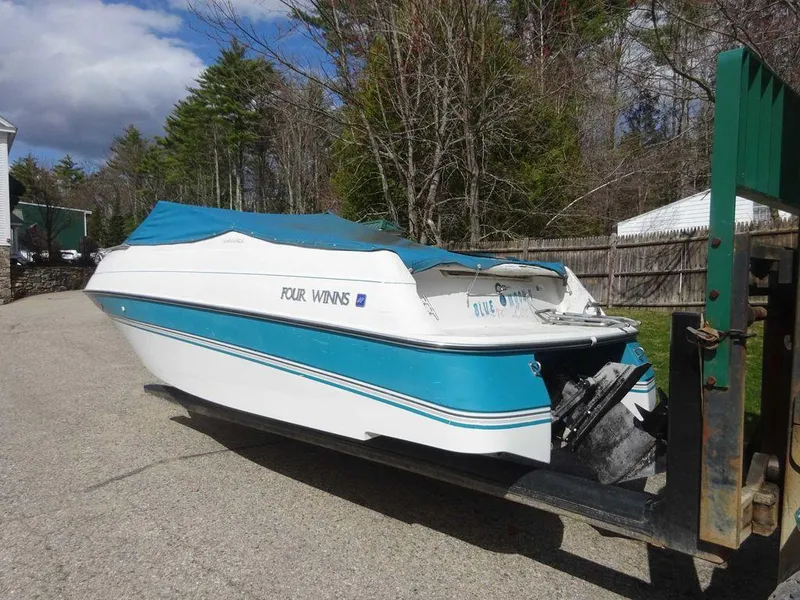 Slide: The Image of 1995 Four Winns 205 Sundowner boat with blue cover on trailer. - 8