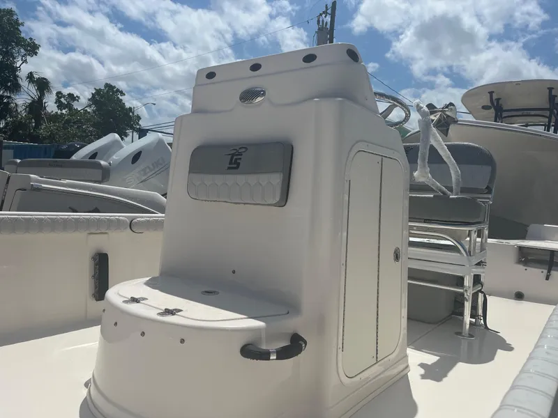 Slide: The Image of 2024 Carolina Skiff 25 LS boat interior with seating and storage compartments. - 10