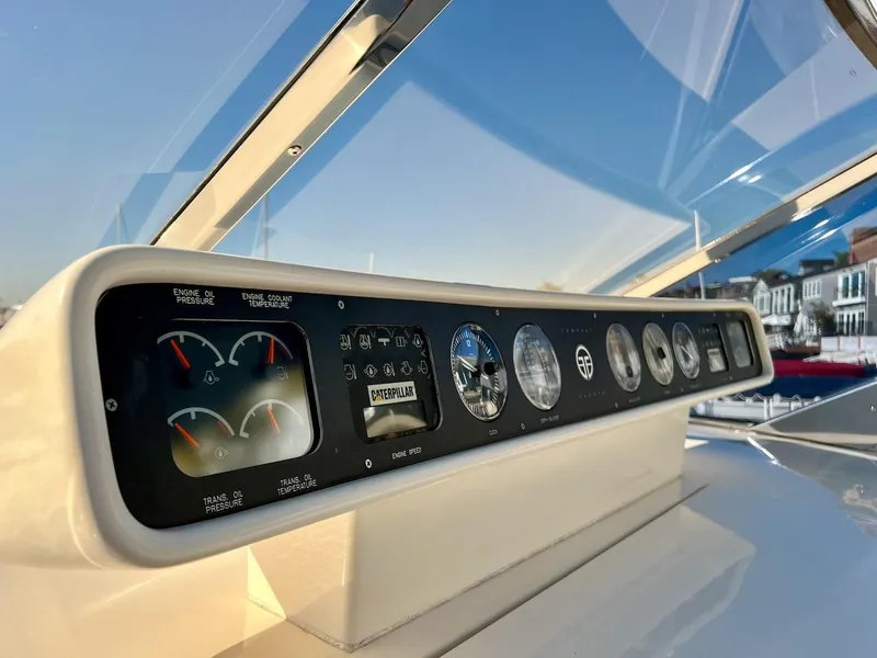 Slide: The Image of Dashboard of a 1990 Tempest Offshore Sport Yacht with various gauges and controls. - 14