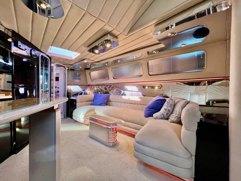 Slide: The Image of Luxurious interior of a 1990 Tempest Offshore Sport Yacht with plush seating and modern decor. - 20