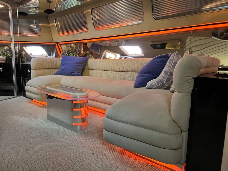 Slide: The Image of Luxurious interior of a 1990 Tempest Offshore Sport Yacht with plush seating and modern decor. - 21