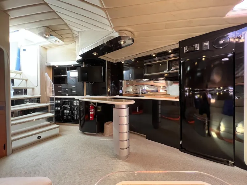 Slide: The Image of Luxurious interior of a 1990 Tempest Offshore Sport Yacht with modern amenities. - 22